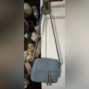 Elegant Blue Crossbody Bag with leopard lining and tassle zippers